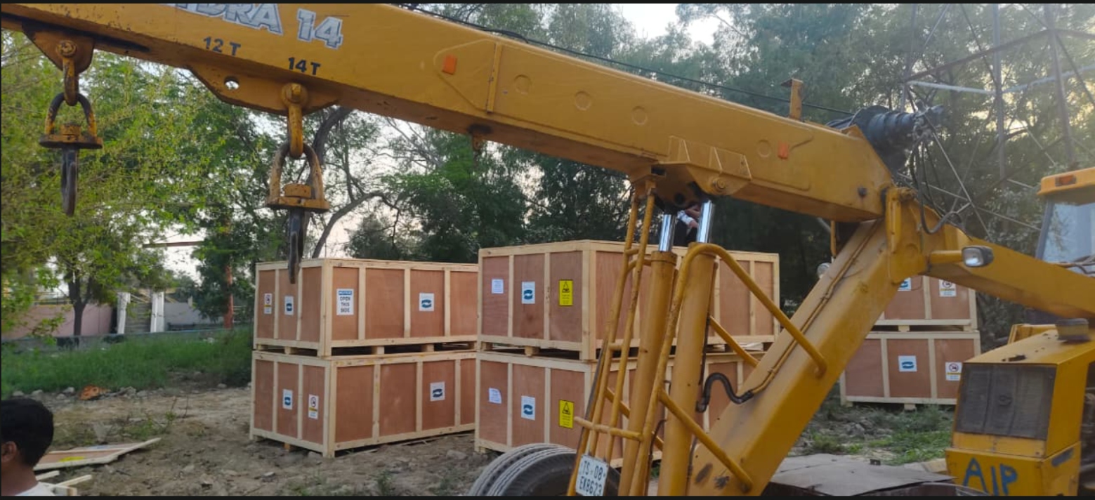 Crane lifting crates during heavy cargo handling in India