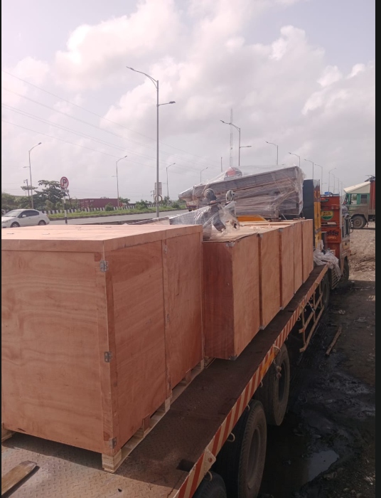 Open body truck loaded with wooden crates for interstate transport India